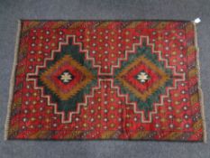 A Baluchi rug 138cm by 92cm