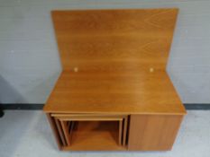 A mid 20th century teak Mcintosh furniture Tristor turn over top coffee table fitted nest of two