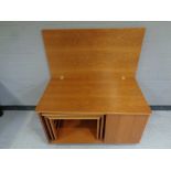 A mid 20th century teak Mcintosh furniture Tristor turn over top coffee table fitted nest of two