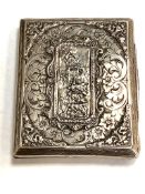 A silver cigarette case depicting a classical scene