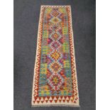 A Chobi kilim runner 191cm by 65cm