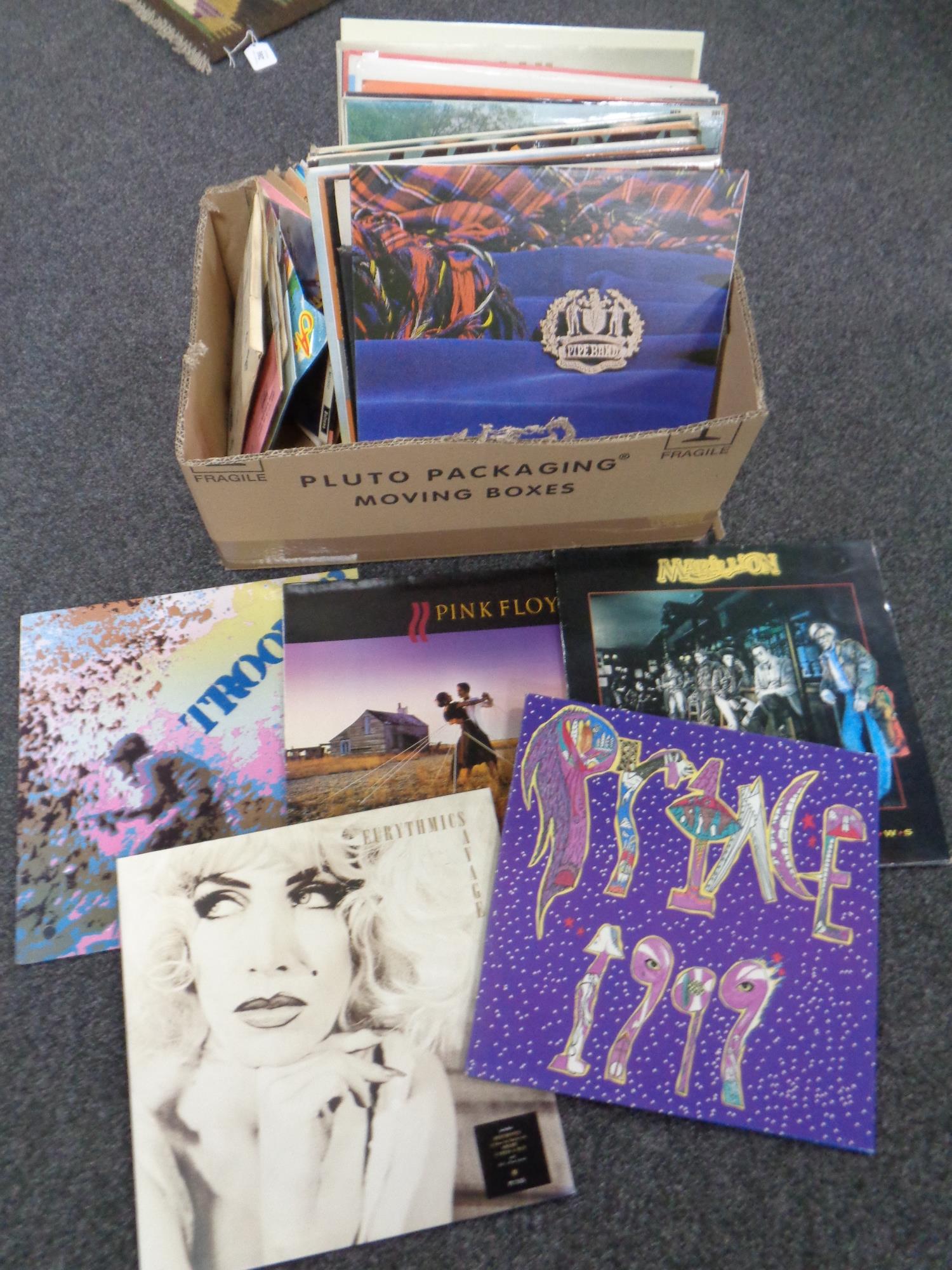 A box containing a small quantity of LPs to include Marillion, Prince, Eurythmics classical,