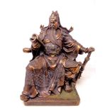 A patinated metal figure of a Chinese warrior