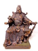 A patinated metal figure of a Chinese warrior