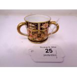 A Royal Crown Derby Imari pattern triple-handled loving cup, height 4 cm.