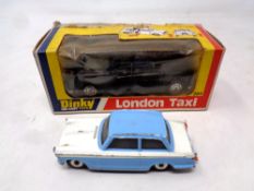 A Dinky 284 London taxi in original box together with a Dinky Toys 189 Triumph Herald