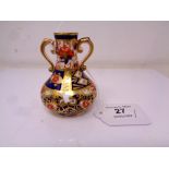 A Royal Crown Derby Imari pattern miniature twin-handled vase, height 8 cm.