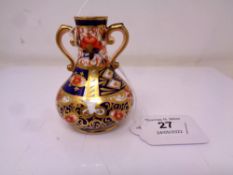 A Royal Crown Derby Imari pattern miniature twin-handled vase, height 8 cm.