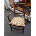 A late Victorian inlaid mahogany rail backed armchair