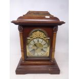 A late 19th century German striking 8 day mantel clock with brass and silvered dial