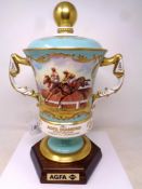 An impressive twin handled trophy cup commissioned by Aynsley, hand painted,