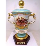 An impressive twin handled trophy cup commissioned by Aynsley, hand painted,