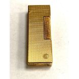 A Dunhill cigarette lighter