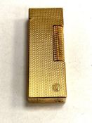 A Dunhill cigarette lighter