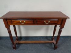 A reproduction hall table fitted two drawers