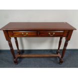 A reproduction hall table fitted two drawers