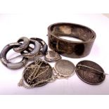 An antique silver bangle, a hardstone set silver brooch (a/f), a locket,