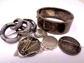 An antique silver bangle, a hardstone set silver brooch (a/f), a locket,