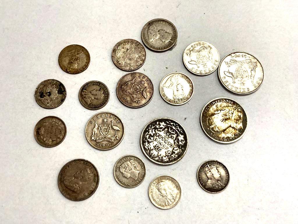 A group of silver coins including Australian six pence's, shillings,
