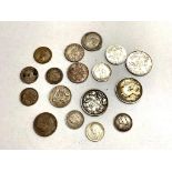 A group of silver coins including Australian six pence's, shillings,