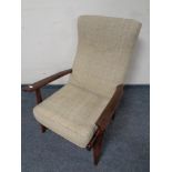 A stained beech armchair in beige upholstery