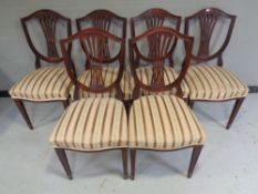 A set of six mahogany shield backed dining chairs