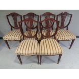 A set of six mahogany shield backed dining chairs