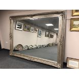 A very impressive silvered floor standing mirror,
