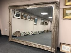 A very impressive silvered floor standing mirror,