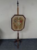 A Victorian mahogany pole screen