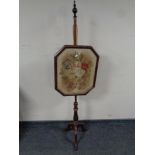 A Victorian mahogany pole screen