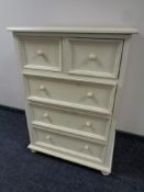A contemporary painted five drawer chest