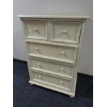 A contemporary painted five drawer chest
