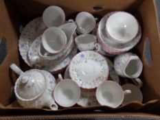 Fifty three pieces of floral-patterned tea and dinner ware.