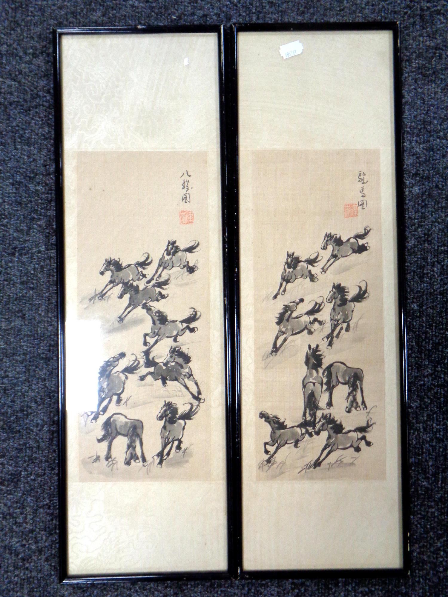 A pair of Japanese watercolours on silk of galloping horses, framed.