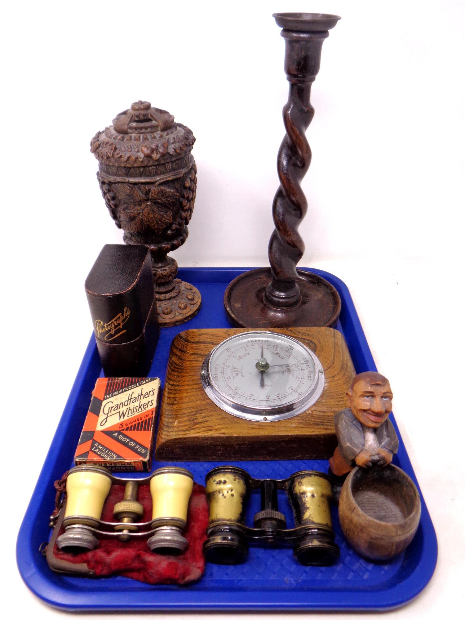 A tray containing miscellanea to include Edwardian oak barely twist candlestick,
