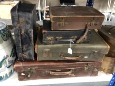 Five 20th century luggage cases.