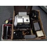 A box containing a large quantity of camera equipment to include Sunzoom lense projector,