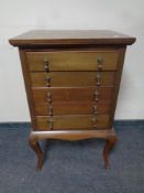 An Edwardian mahogany music cabinet