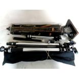 A box containing wooden tripod projector stand together with four assorted camera tripods