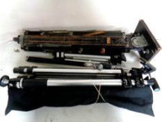 A box containing wooden tripod projector stand together with four assorted camera tripods