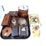 A tray containing miscellany to include an Edwardian oak and silver plated biscuit barrel,