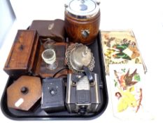 A tray containing miscellany to include an Edwardian oak and silver plated biscuit barrel,