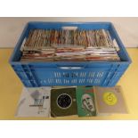 A crate containing a large quantity of vinyl 7" singles to include Neil Diamond, Queen, The Beatles,