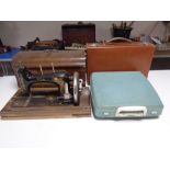 An Ideal vintage hand sewing machine in case together with a typewriter and a leather luggage case.