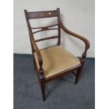 A reproduction mahogany carver chair with dralon seat