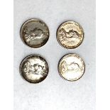 Four 1887 shillings