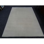 A contemporary cream rug