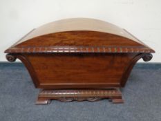A 19th century mahogany dome-top cellaret with lead-lined interior.
