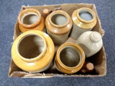 A box containing antique stone ware jars, cider bottles, hot water bottle.